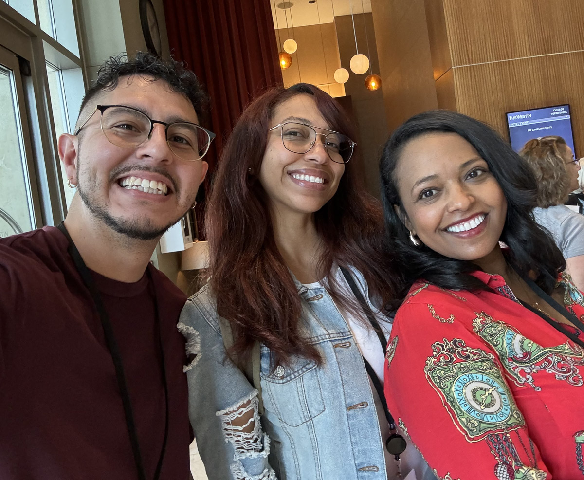 three people smiling